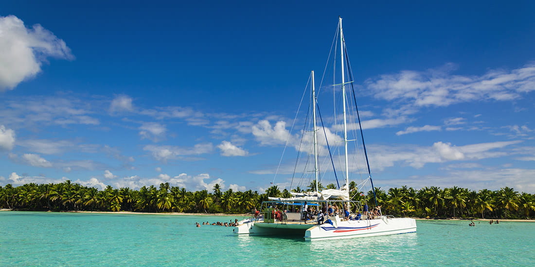 White catamaran on azure water against blue sky, Caribbean Islands